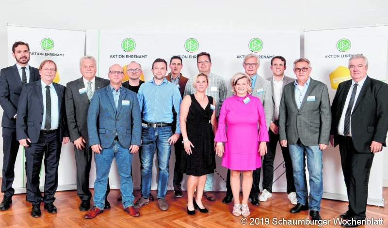 HAMBURG, GERMANY - SEPTEMBER 06: DFB general secretary Friedrich Curtius (L) and Rainer Koch, First Vice President of DFB, (2nd L) pose with delegates of the Lower Saxony Football Association during the award ceremony 'Club 100' at Curio Haus on September